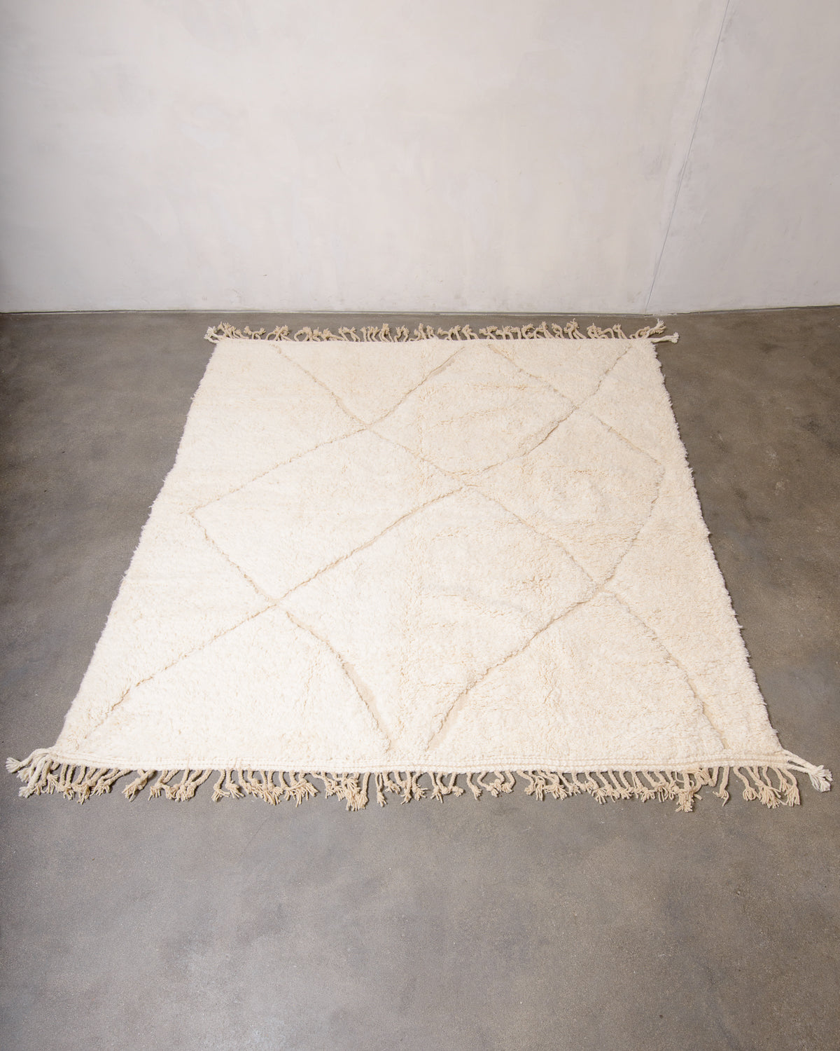 Modern, designer, handcrafted Berber rug from Morocco. Beniourain carpet with minimalist design, natural wool pile and a fluffy texture.